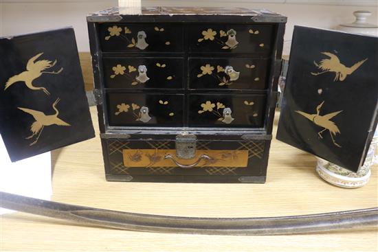 A Japanese lacquer cabinet on stand